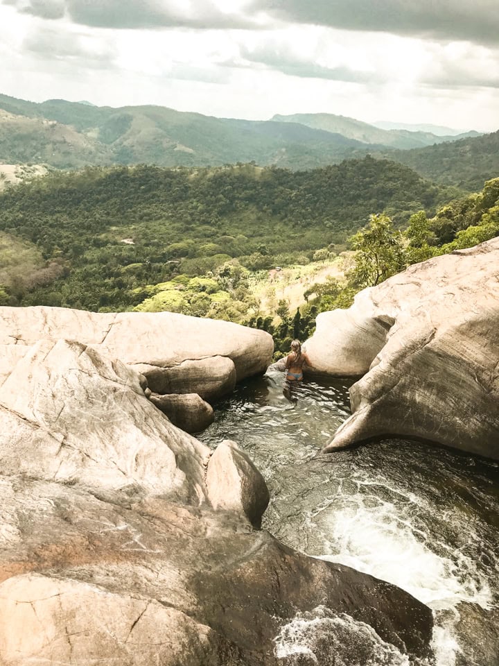 spellbound travels girl at diyaluma waterfalls sri lanka 