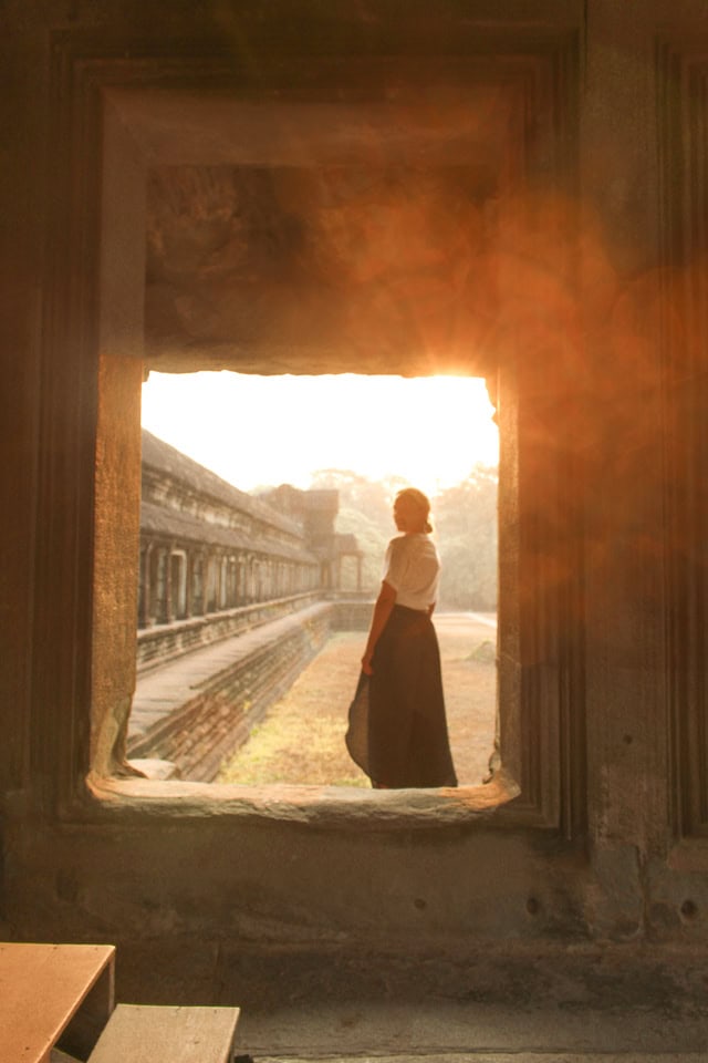 spellbound travels girl standing at angkor wat cambodia